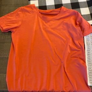 Hey girls i’m selling a Lulu Lemon size small orange shirt!!